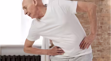 An old man exercising